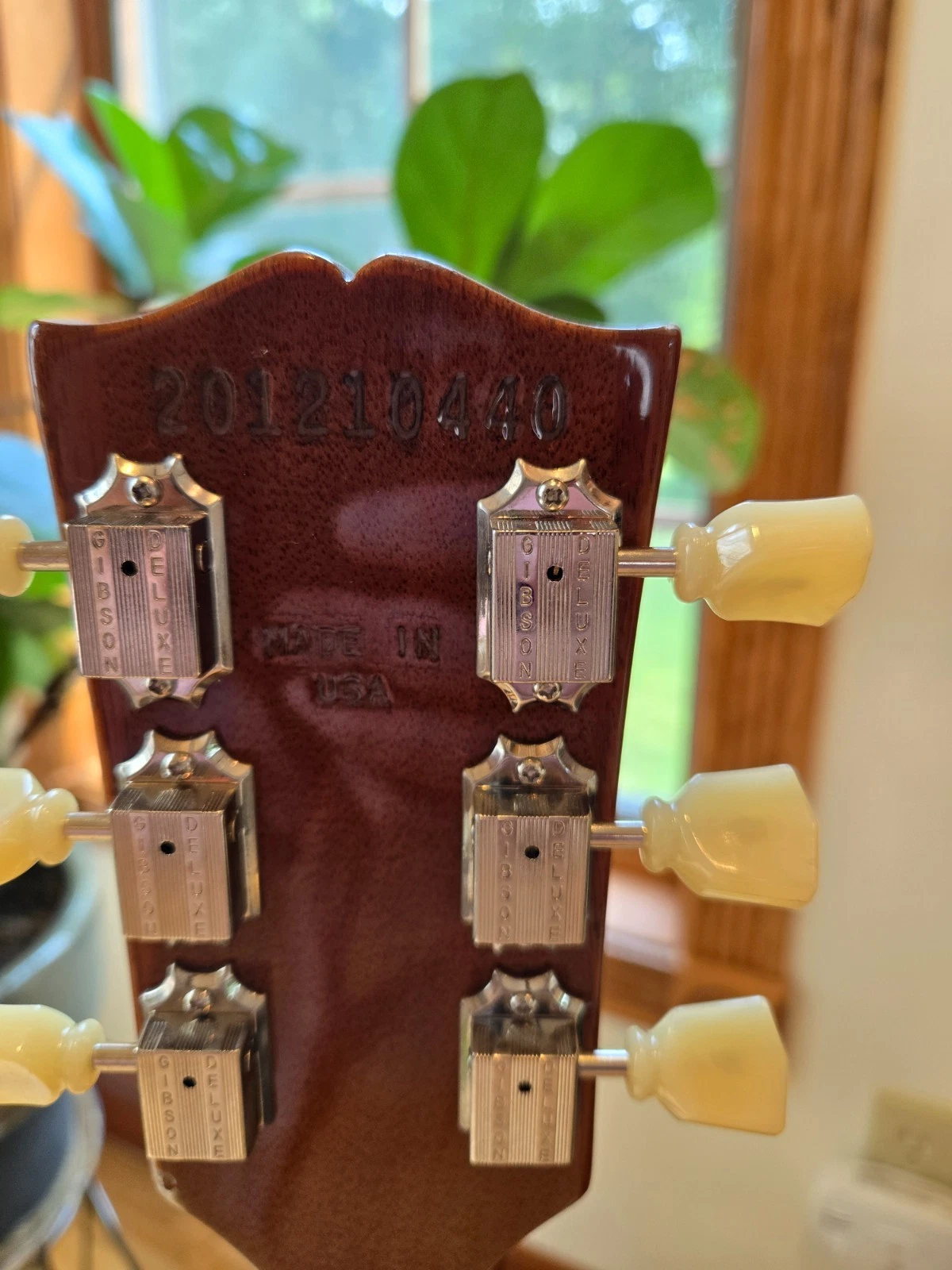Vintage guitar headstock detail showing craftsmanship and original hardware